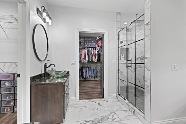 13030 County Lane 228, Oronogo, MO 64855 - bathroom featuring double vanity, a shower stall, a spacious closet, and marble finish floors