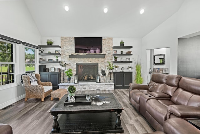 13030 County Lane 228, Oronogo, MO 64855 - living area with high vaulted ceiling, wood finished floors, a fireplace, and recessed lighting