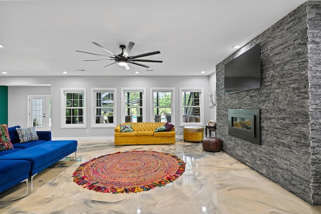 13030 County Lane 228, Oronogo, MO 64855 - living room with a ceiling fan, recessed lighting, a stone fireplace, and marble tiled floors