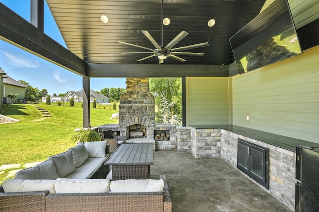 13030 County Lane 228, Oronogo, MO 64855 - view of patio / terrace with an outdoor living space with a fireplace and a ceiling fan