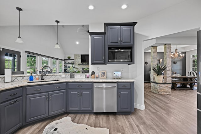 13030 County Lane 228, Oronogo, MO 64855 - kitchen with appliances with stainless steel finishes, a chandelier, light wood-type flooring, hanging light fixtures, and recessed lighting