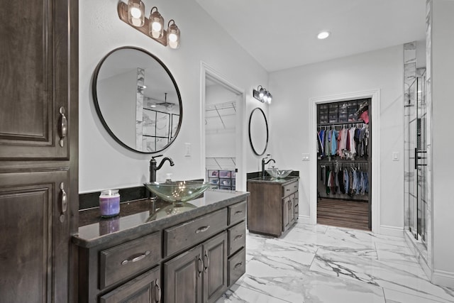13030 County Lane 228, Oronogo, MO 64855 - bathroom with two vanities, a stall shower, a walk in closet, marble finish flooring, and recessed lighting