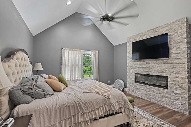 13030 County Lane 228, Oronogo, MO 64855 - bedroom with lofted ceiling, wood finished floors, a fireplace, and ceiling fan