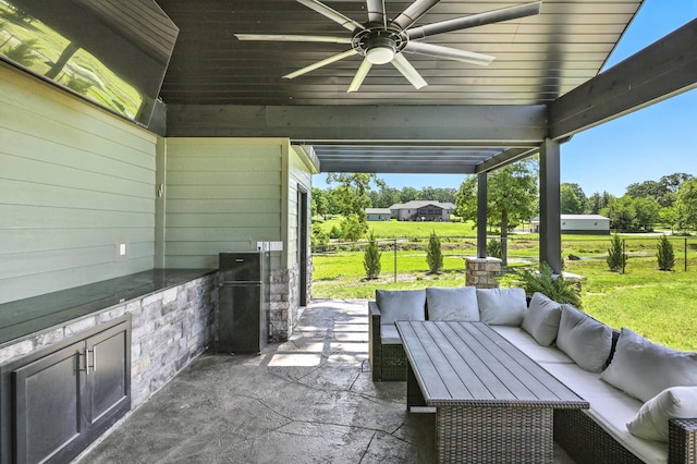 13030 County Lane 228, Oronogo, MO 64855 - view of patio with an outdoor hangout area, a ceiling fan, and an outdoor kitchen