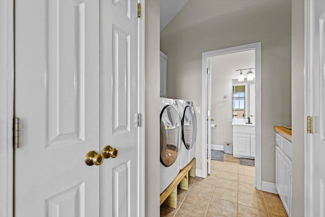 4201 N Farm Rd Unit 205, Strafford, MO 65757 - laundry area with separate washer and dryer, cabinet space, and light tile patterned floors