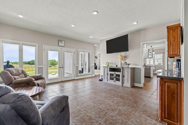 4201 N Farm Rd Unit 205, Strafford, MO 65757 - living area with french doors, recessed lighting, a textured ceiling, and dark tile patterned flooring