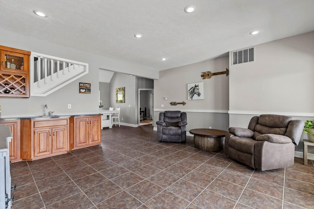 4201 N Farm Rd Unit 205, Strafford, MO 65757 - interior space featuring recessed lighting, dark tile patterned floors, open floor plan, and light countertops
