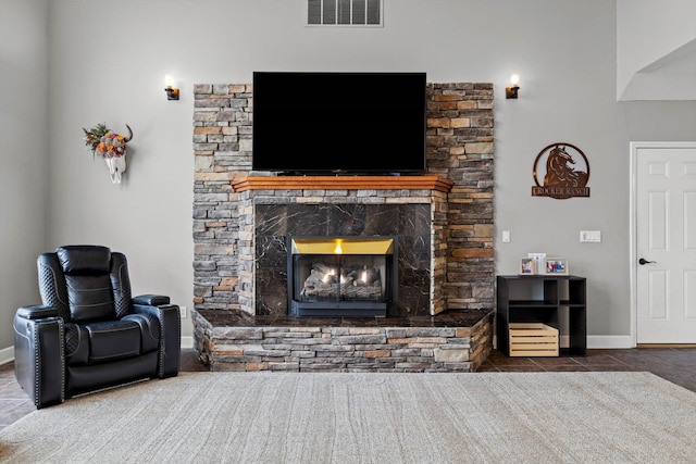 4201 N Farm Rd Unit 205, Strafford, MO 65757 - tiled living area with a stone fireplace and baseboards