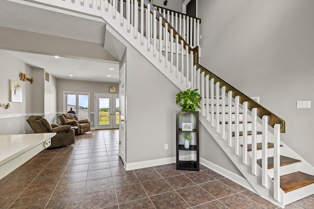 4201 N Farm Rd Unit 205, Strafford, MO 65757 - stairway with french doors, tile patterned floors, and recessed lighting