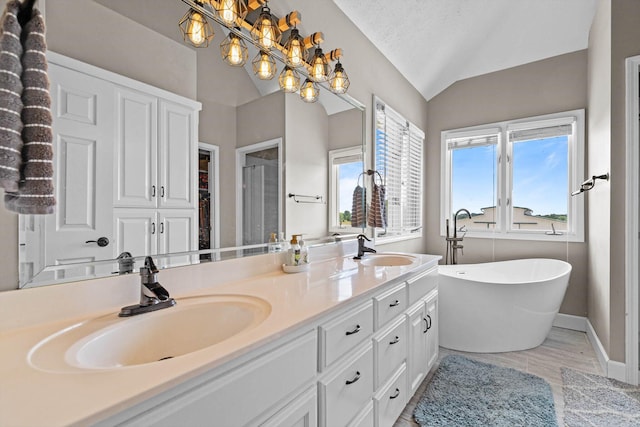 4201 N Farm Rd Unit 205, Strafford, MO 65757 - bathroom featuring double vanity, a soaking tub, lofted ceiling, a stall shower, and a chandelier