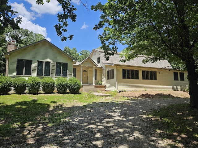 8696 Lawrence Unit 2226, Monett, MO 65708 - view of front facade with a chimney and covered porch