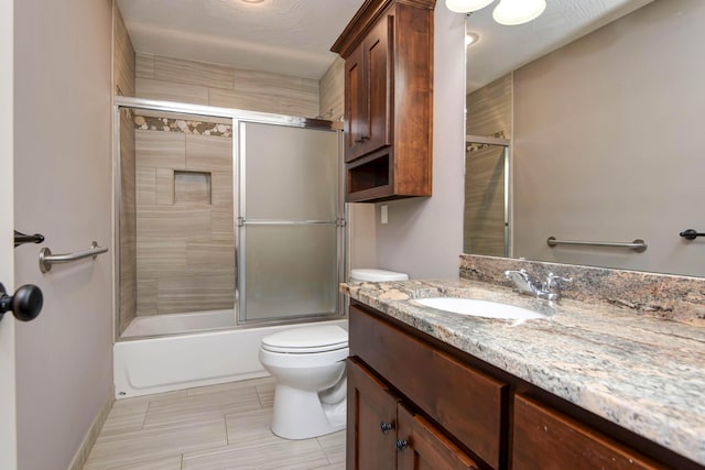 5795 S Wedgewood Ave, Springfield, MO 65810 - bathroom featuring vanity, combined bath / shower with glass door, and tile patterned floors