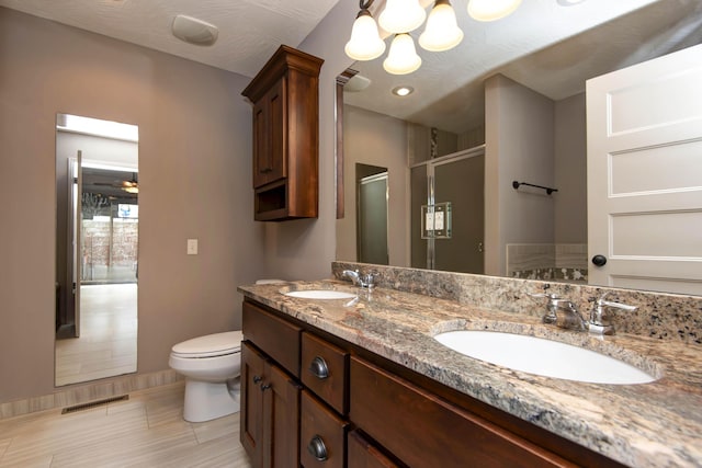 5795 S Wedgewood Ave, Springfield, MO 65810 - full bathroom with a stall shower, double vanity, and a chandelier