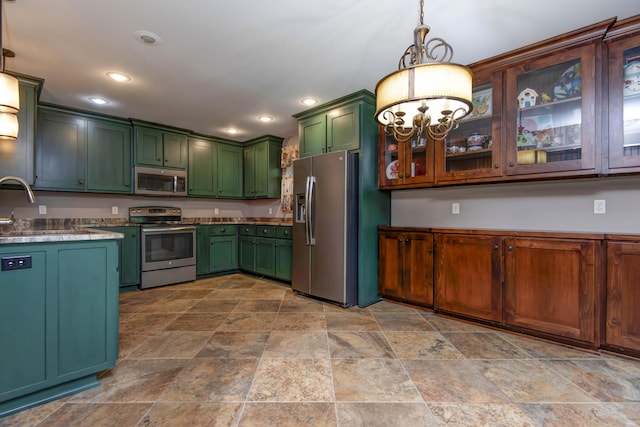 5795 S Wedgewood Ave, Springfield, MO 65810 - kitchen with green cabinetry, stainless steel appliances, a chandelier, stone finish floors, and recessed lighting