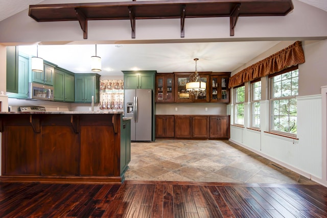 5795 S Wedgewood Ave, Springfield, MO 65810 - kitchen with green cabinetry, stainless steel appliances, a breakfast bar area, hardwood / wood-style flooring, and glass insert cabinets
