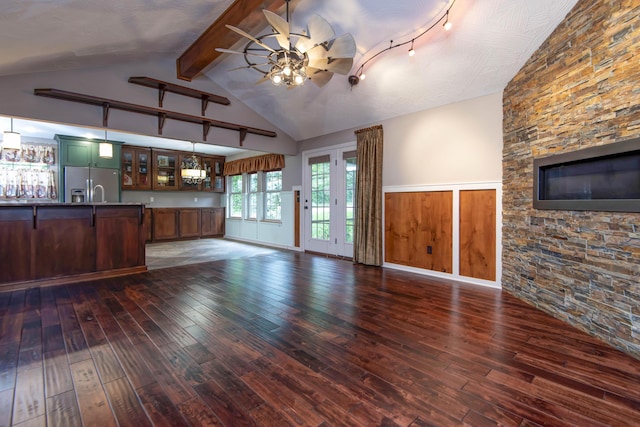 5795 S Wedgewood Ave, Springfield, MO 65810 - unfurnished living room featuring wood-type flooring, ceiling fan, wainscoting, beamed ceiling, and bar area