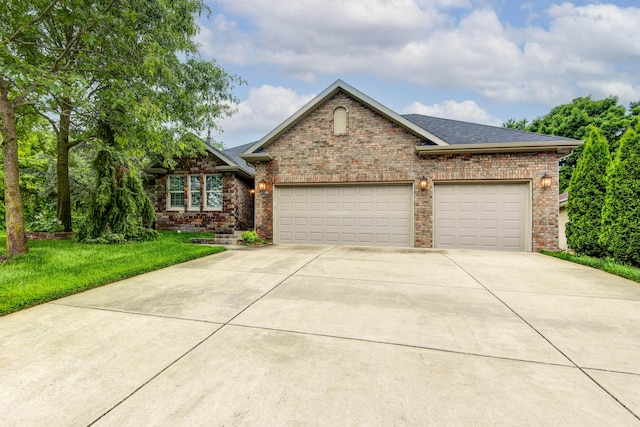 5795 S Wedgewood Ave, Springfield, MO 65810 - view of front facade featuring driveway, an attached garage, brick siding, a shingled roof, and a front lawn