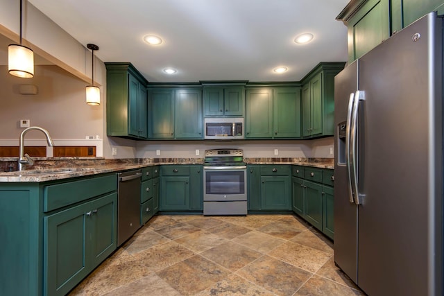 5795 S Wedgewood Ave, Springfield, MO 65810 - kitchen with appliances with stainless steel finishes, stone tile floors, decorative light fixtures, recessed lighting, and green cabinetry