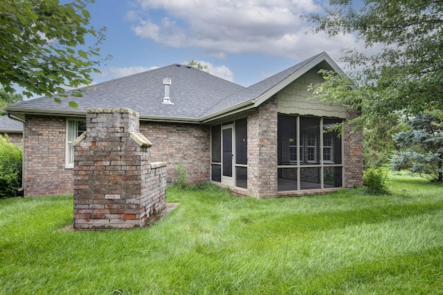 5795 S Wedgewood Ave, Springfield, MO 65810 - rear view of property with a sunroom, a yard, and a shingled roof