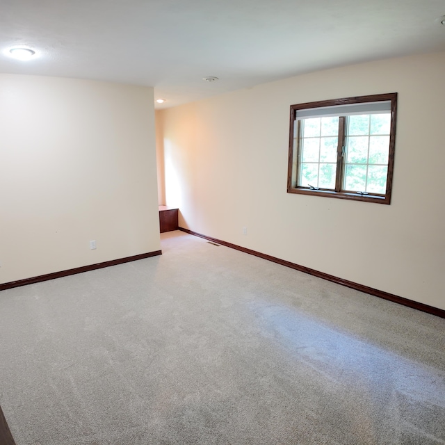 3352 W State Highway 76, Cape Fair, MO 65624 - spare room featuring light colored carpet and baseboards