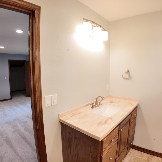 3352 W State Highway 76, Cape Fair, MO 65624 - bathroom featuring vanity, recessed lighting, and wood finished floors