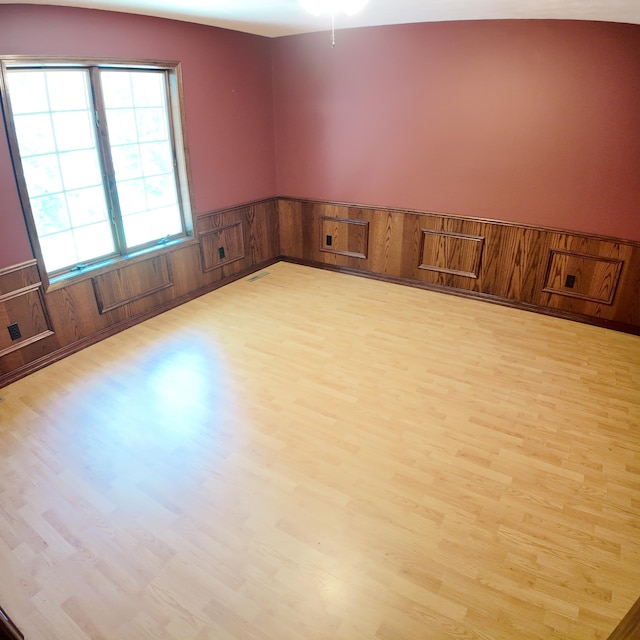 3352 W State Highway 76, Cape Fair, MO 65624 - spare room with light wood finished floors, a wainscoted wall, and wood walls