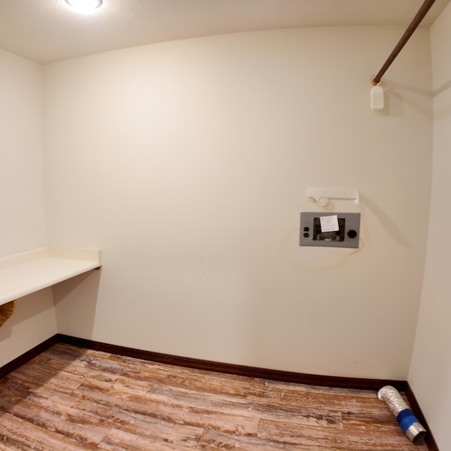 3352 W State Highway 76, Cape Fair, MO 65624 - laundry room featuring wood finished floors and baseboards