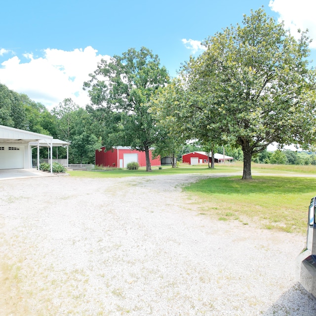 3352 W State Highway 76, Cape Fair, MO 65624 - view of green lawn with a garage and an outdoor structure