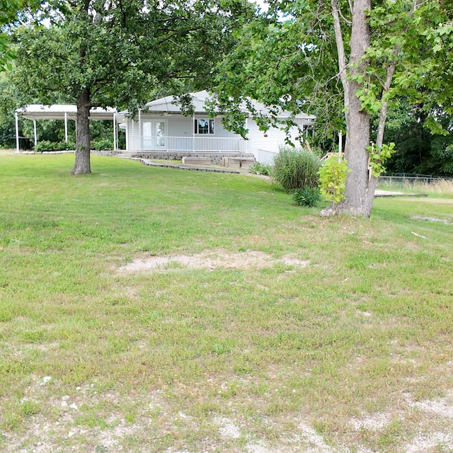 3352 W State Highway 76, Cape Fair, MO 65624 - view of yard featuring covered porch and a detached carport