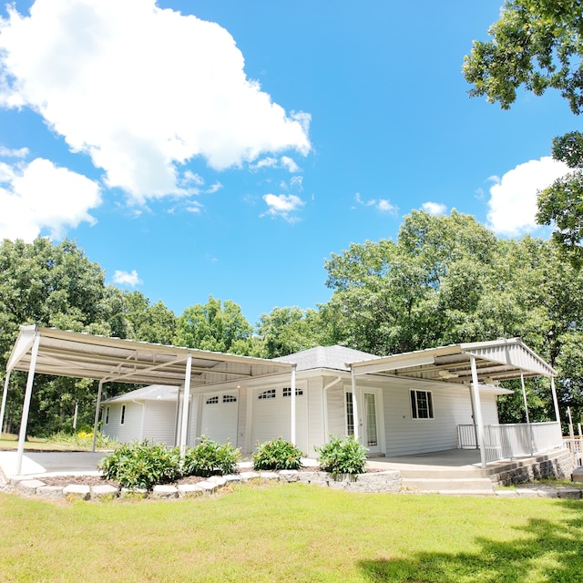 3352 W State Highway 76, Cape Fair, MO 65624 - rear view of property with a lawn and an attached garage