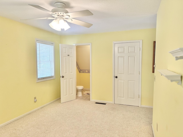 26569 County Road 225, Flemington, MO 65650 - unfurnished bedroom with carpet flooring, ensuite bathroom, and ceiling fan