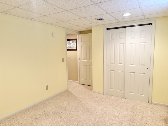 26569 County Road 225, Flemington, MO 65650 - unfurnished bedroom featuring a paneled ceiling, light colored carpet, and a closet