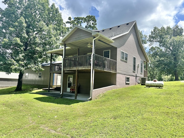 26569 County Road 225, Flemington, MO 65650 - back of property featuring a ceiling fan, a patio, a yard, and a wooden deck