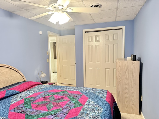 26569 County Road 225, Flemington, MO 65650 - carpeted bedroom with a paneled ceiling, a closet, and ceiling fan