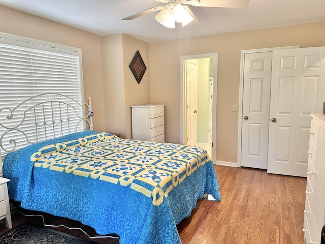 26569 County Road 225, Flemington, MO 65650 - bedroom with wood finished floors, a ceiling fan, and ensuite bath