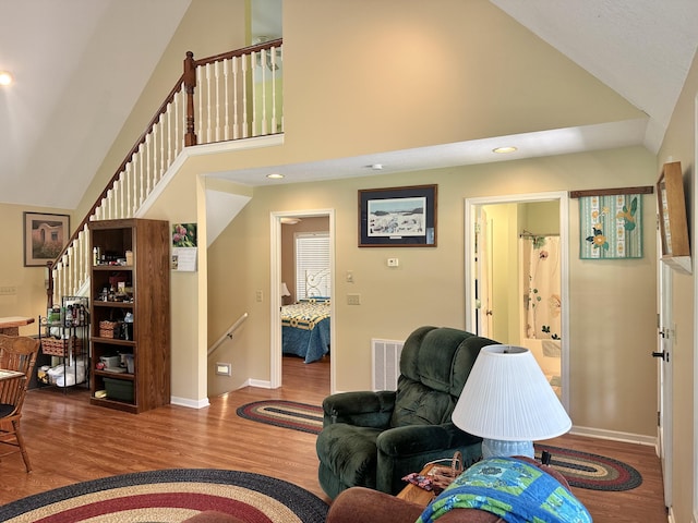26569 County Road 225, Flemington, MO 65650 - living area featuring wood finished floors, high vaulted ceiling, and recessed lighting