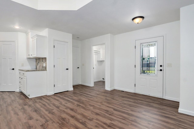 2000 E Greenwich Dr, Ozark, MO 65721 - foyer featuring dark wood-style flooring and baseboards