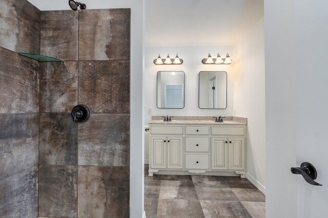 2000 E Greenwich Dr, Ozark, MO 65721 - bathroom featuring double vanity and a tile shower