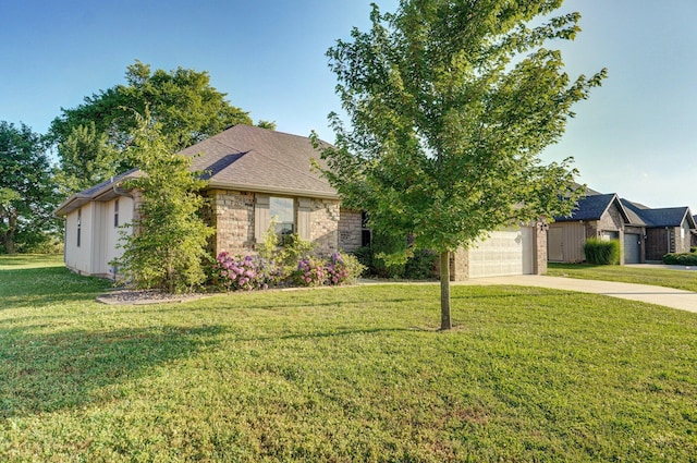 2000 E Greenwich Dr, Ozark, MO 65721 - view of front of home with concrete driveway, a front lawn, brick siding, and a garage