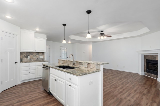 2000 E Greenwich Dr, Ozark, MO 65721 - kitchen featuring stainless steel dishwasher, a raised ceiling, dark wood finished floors, a ceiling fan, and open floor plan