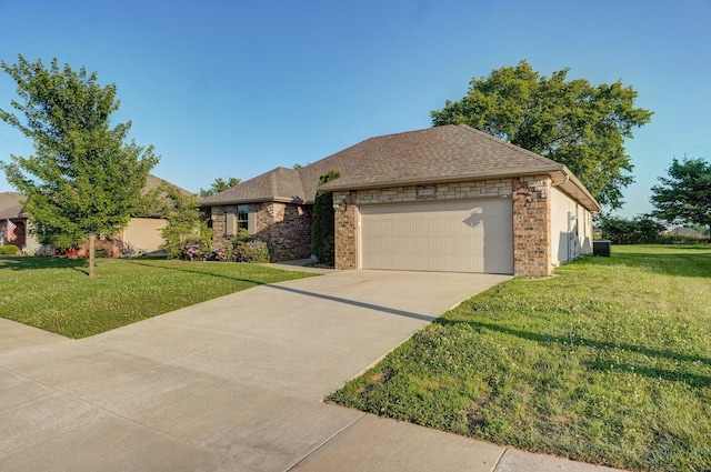 2000 E Greenwich Dr, Ozark, MO 65721 - view of front of home with a front yard, a garage, concrete driveway, brick siding, and a shingled roof