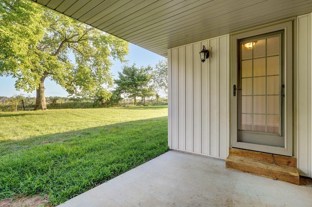 2000 E Greenwich Dr, Ozark, MO 65721 - property entrance featuring board and batten siding and a yard