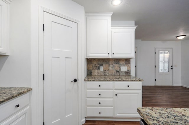 2000 E Greenwich Dr, Ozark, MO 65721 - kitchen with tasteful backsplash, dark wood-style flooring, white cabinets, and light stone counters