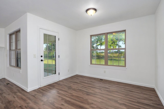 2000 E Greenwich Dr, Ozark, MO 65721 - spare room featuring dark wood-style floors and baseboards
