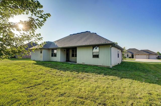 2000 E Greenwich Dr, Ozark, MO 65721 - back of property featuring a lawn and a shingled roof