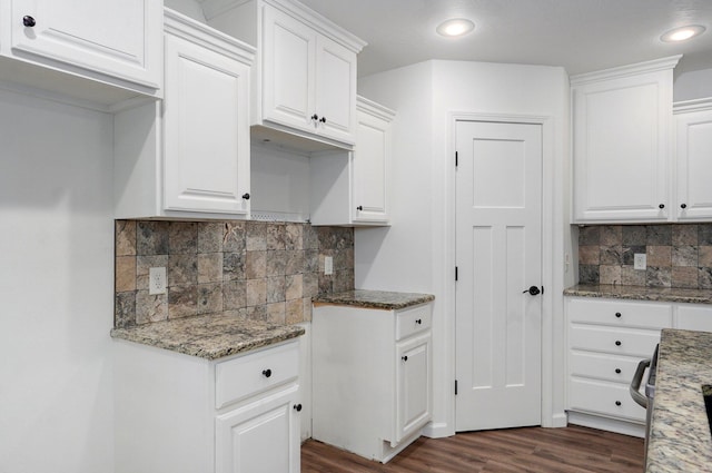 2000 E Greenwich Dr, Ozark, MO 65721 - kitchen featuring dark wood-style flooring, decorative backsplash, light stone counters, recessed lighting, and white cabinets