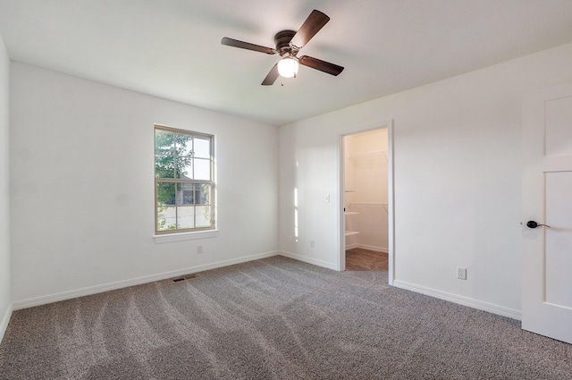 2000 E Greenwich Dr, Ozark, MO 65721 - unfurnished bedroom featuring carpet floors and a ceiling fan