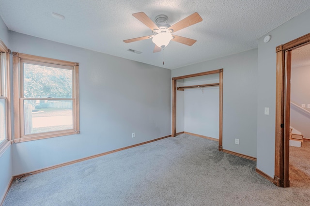 4147 E Kellis Ct, Springfield, MO 65802 - unfurnished bedroom featuring carpet floors, a textured ceiling, a closet, and ceiling fan