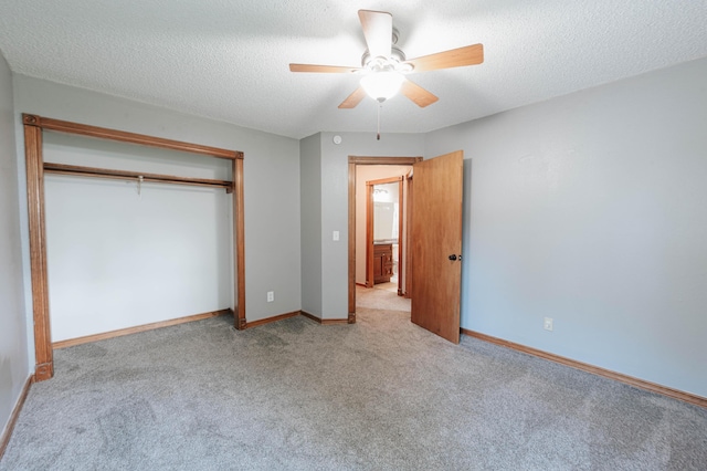 4147 E Kellis Ct, Springfield, MO 65802 - unfurnished bedroom featuring carpet, a closet, a textured ceiling, and ceiling fan