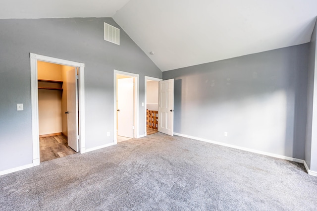 4147 E Kellis Ct, Springfield, MO 65802 - unfurnished bedroom featuring carpet floors, high vaulted ceiling, a walk in closet, and a closet